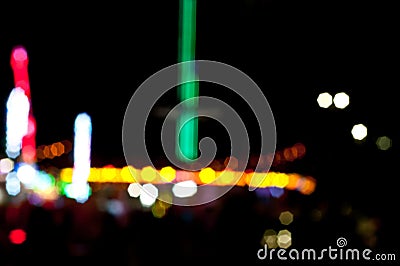 Abstract random colourful defocused blurred night life of fun fair background pattern Stock Photo