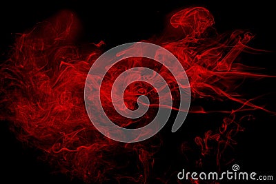 Abstract red smoke on black background. Dramatic red smoke clouds. Movement of colorful smoke Stock Photo