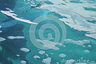 Glacier blue water surface with bubbles and wavelets Stock Photo