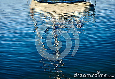 Abstract reflections of boats in the harbor water Stock Photo