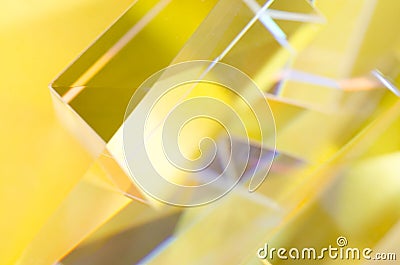 Abstract reflections of glass prisms in yellow light Stock Photo