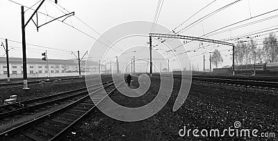 Abstract russian railway depressive cityscape with lonely old women figure Stock Photo