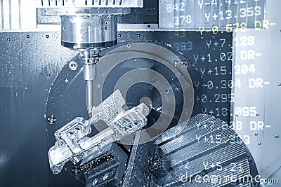 The abstract scene of 5 axis CNC milling machine cutting the aerospace part with the g-code data background. Stock Photo