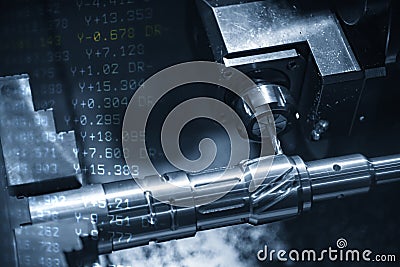 The abstract scene of CNC lathe machine milling the metal shaft and the G-code data background. Stock Photo