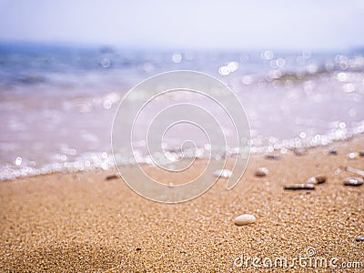 Abstract sea background. Abstract sandy summer beach background with bokeh lights on light blue sky. Beautiful texture. Space Stock Photo