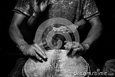 Four handed djembe drum playing Stock Photo