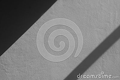 Abstract shadow on a white cement wall in the room. Stock Photo