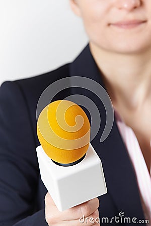 Abstract Shot Of Female Journalist With Microphone Stock Photo