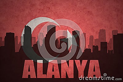 Abstract silhouette of the city with text Alanya at the vintage turkish flag Stock Photo