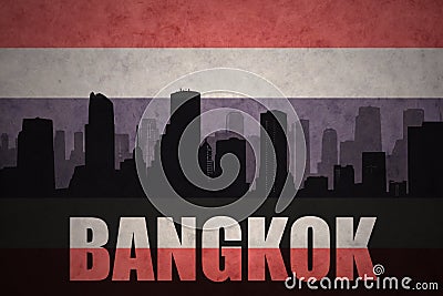 Abstract silhouette of the city with text Bangkok at the vintage thailand flag Stock Photo