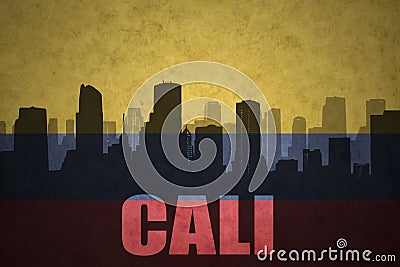 Abstract silhouette of the city with text Cali at the vintage colombian flag Stock Photo