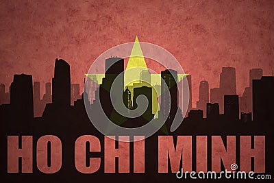 Abstract silhouette of the city with text Ho Chi Minh at the vintage vietnamese flag Stock Photo