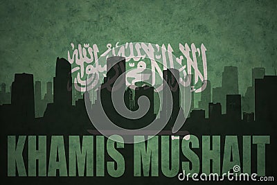 Abstract silhouette of the city with text Khamis Mushait at the vintage saudi arabia flag Stock Photo