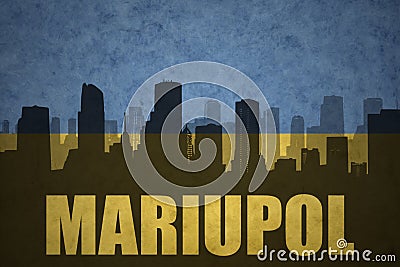Abstract silhouette of the city with text Mariupol at the vintage ukrainian flag Stock Photo