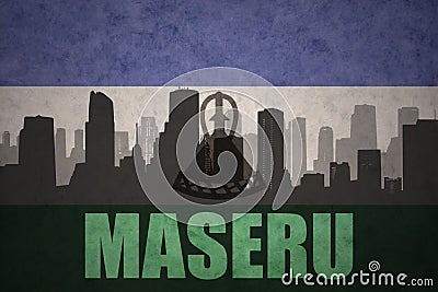 Abstract silhouette of the city with text Maseru at the vintage lesotho flag Stock Photo