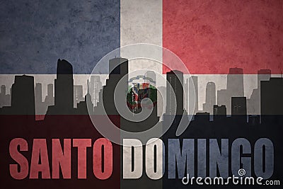 Abstract silhouette of the city with text Santo Domingo at the vintage dominican republic flag Stock Photo