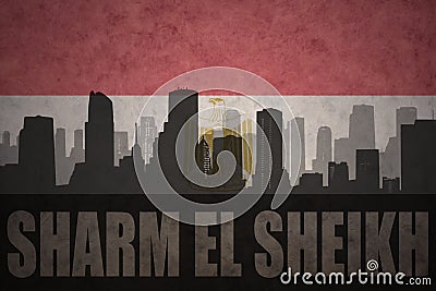 Abstract silhouette of the city with text Sharm El Sheikh at the vintage egyptian flag Stock Photo