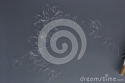 Abstract silver thread pile and spool of silver thread. Stock Photo