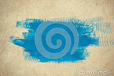 Abstract simple background brushstrokes of blue paint on a beige background Stock Photo