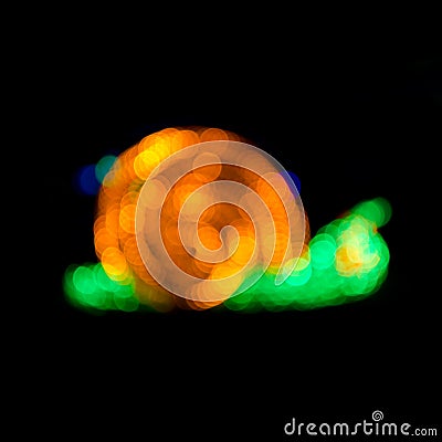Abstract snail shape de-focused lights bokeh Stock Photo