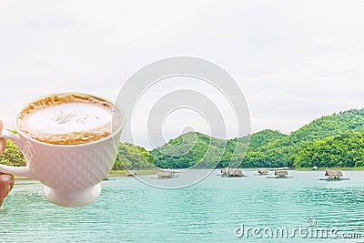 Abstract soft blurred and soft focus a cup of coffee,the raft,the swamp,the mountain beautiful sky and cloud at Huai Krathing, Lo Stock Photo
