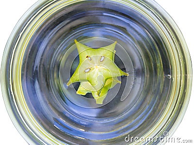 Abstract spinning water with star apple in bowl isolated on whit Stock Photo