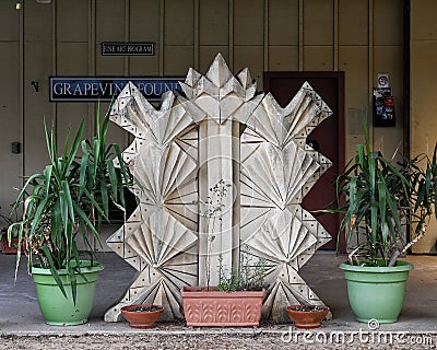 Abstract stone piece by unidentified artist in front of the Grapevine Foundry in the historic district of Grapevine, Texas. Editorial Stock Photo