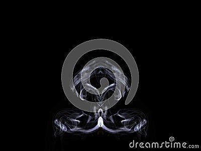 Abstract symetrical shaped smoke against black background Stock Photo