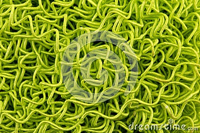 Abstract texture of green twisted threads or rubber bands macro background from close up Stock Photo