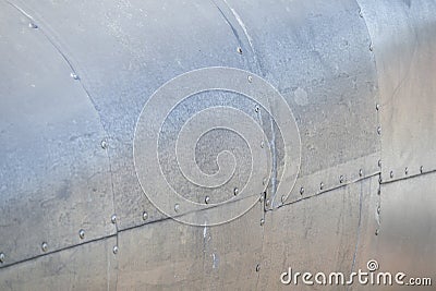 Abstract unpainted metal texture. The background is made of screwed pieces of aluminum. Soft focus Stock Photo
