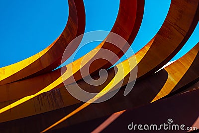 Abstract view of modern sculptural architecture with vibrant red and yellow curves. Stock Photo