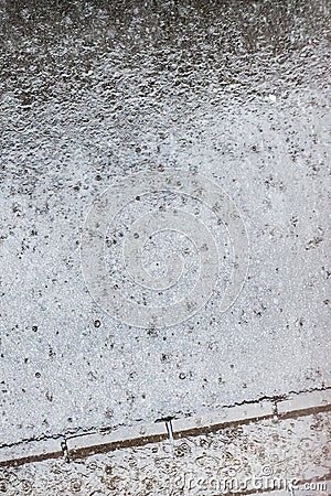 Abstract view of raindrops falls on street sidewalk. Rain drops Stock Photo