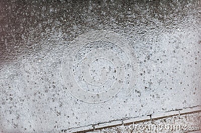 Abstract view of raindrops falls on street sidewalk. Rain drops Stock Photo