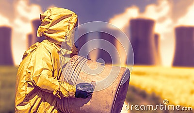 Abstract view of smoking coal power plant and men in protective hazmat suit Stock Photo