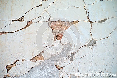 Abstract vintage texture and background of crack and broken plastered cement surface on the brickwork wall Stock Photo