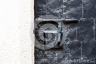 Abstract vintage textured background with a combined latch and lock screws texture of rust and plaster . Stock Photo