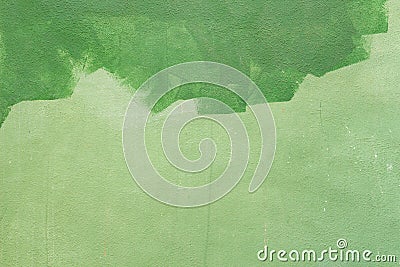 Abstract wall background. Wall half fresh painted in green color Stock Photo