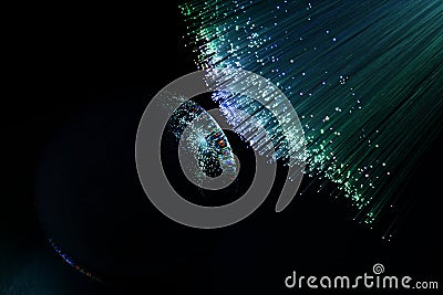 Abstract background with colored fibers optics reflected on glass sphere Stock Photo