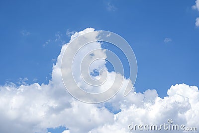 Abstract white cloud like puddle dog animal flufy shape on blue sky background. beauty high natural in summer season Stock Photo