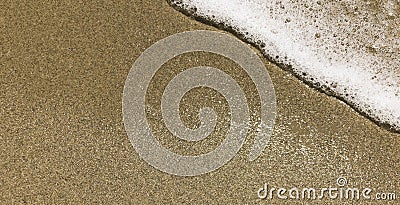 Abstract White Sea Foam and Black Sand. Small Wave Stock Photo