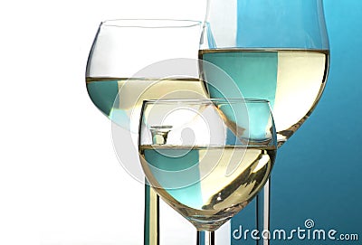 Abstract wine glasses, background half blue, half white, copy sp Stock Photo