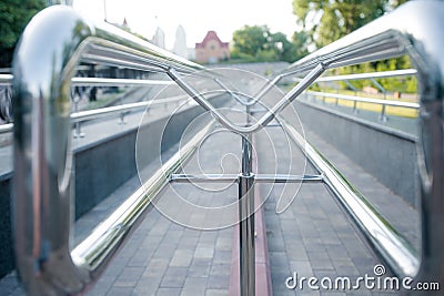Abstraction descending line on the road chrome pipes and path and stones Stock Photo