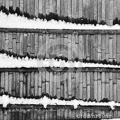 Abstration with wooden fence and snow Stock Photo