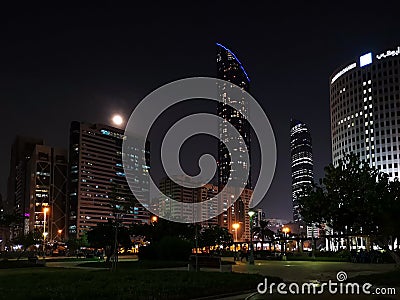 Abu Dhabi city skyline, Sheikh Mohammed Al Maktoum tower at night Editorial Stock Photo