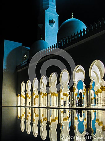 Abu Dhabi Sheik Zayed Mosque beautiful details and architecture with reflections on water at night Editorial Stock Photo