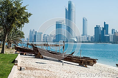 Abu Dhabi skyline plus racing Dhows in the forground Stock Photo