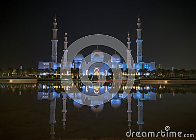 A night view of Sheikh Zayed Grand Mosque from a water reflectio Editorial Stock Photo
