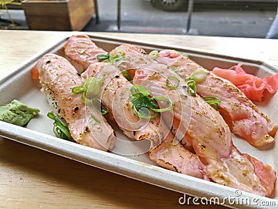 Aburi slightly grilled fatty salmon belly nigiri sushi Stock Photo