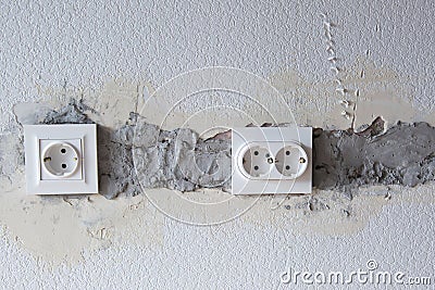 AC power socket in wall. Repairs in the apartment Stock Photo