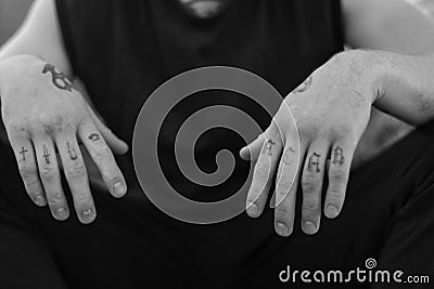 ACAB tattoo on the arm of a bully man. Black and white photo Stock Photo